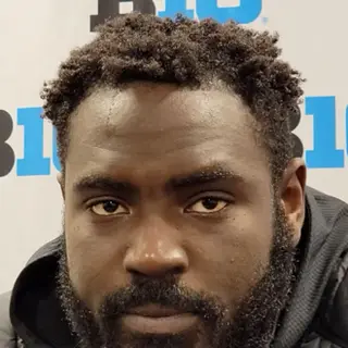 Portrait of Sam Okuayinonu